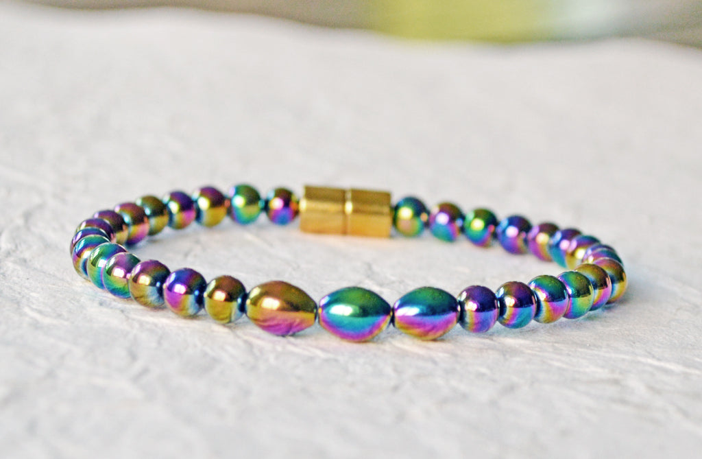 Magnetic bracelet handcrafted with iridescent rainbow hematite magnetic beads. Bracelet is secured with a strong and easy-to-use magnetic clasp.