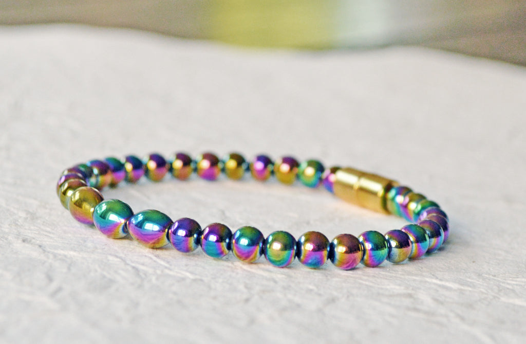 Magnetic bracelet handcrafted with iridescent rainbow hematite magnetic beads. Bracelet is secured with a strong and easy-to-use magnetic clasp.