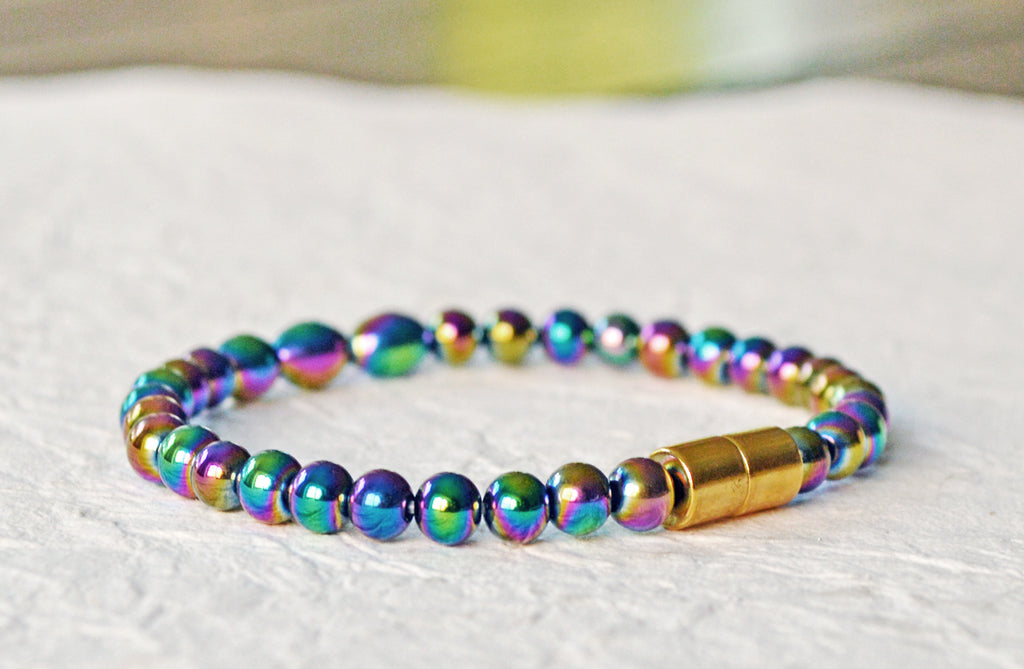 Magnetic bracelet handcrafted with iridescent rainbow hematite magnetic beads. Bracelet is secured with a strong and easy-to-use magnetic clasp.