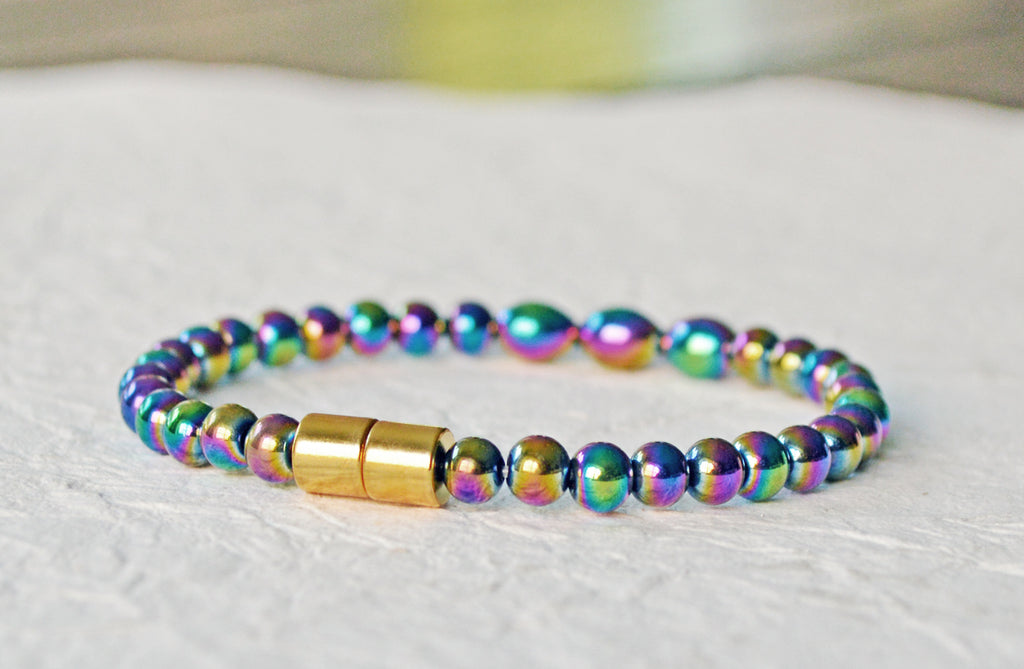 Magnetic bracelet handcrafted with iridescent rainbow hematite magnetic beads. Bracelet is secured with a strong and easy-to-use magnetic clasp.