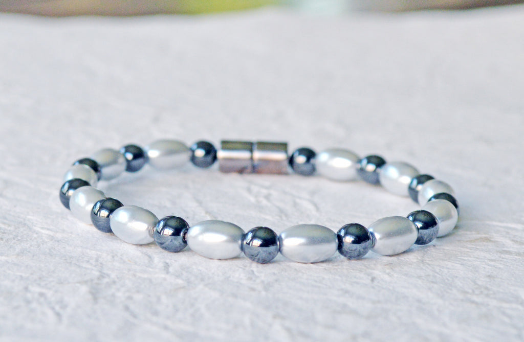 Magnetic bracelet handcrafted with alternating black and silver hematite magnetic beads. Bracelet secured with a sturdy, easy-to-use magnetic clasp.