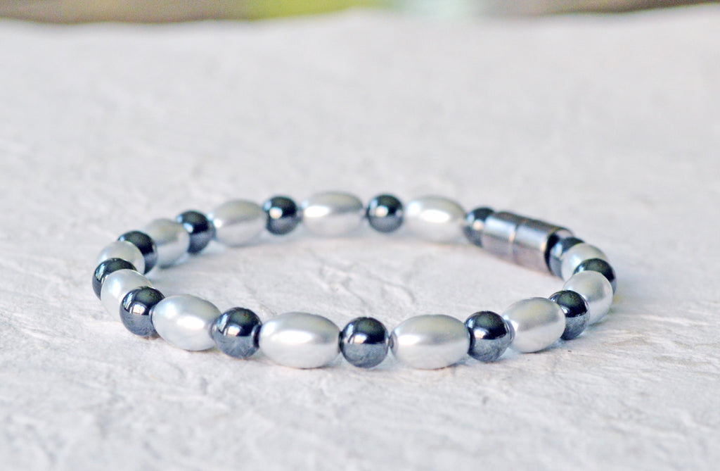 Magnetic bracelet handcrafted with alternating black and silver hematite magnetic beads. Bracelet secured with a sturdy, easy-to-use magnetic clasp.