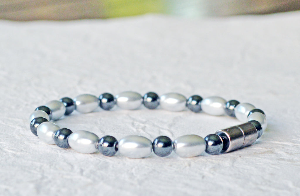 Magnetic bracelet handcrafted with alternating black and silver hematite magnetic beads. Bracelet secured with a sturdy, easy-to-use magnetic clasp.