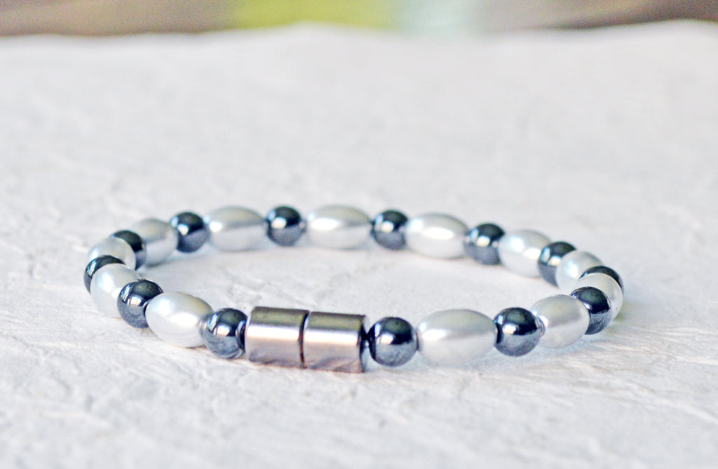 Magnetic bracelet handcrafted with alternating black and silver hematite magnetic beads. Bracelet secured with a sturdy, easy-to-use magnetic clasp.