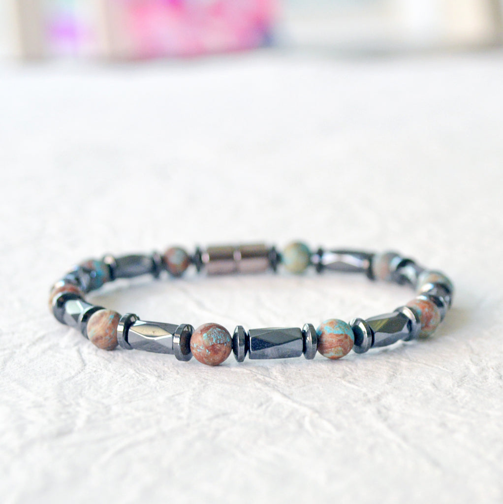 Magnetic bracelet handcrafted with black hematite magnetic beads and blue lace agate gemstone beads. Secured with a strong and easy-to-use magnetic clasp.