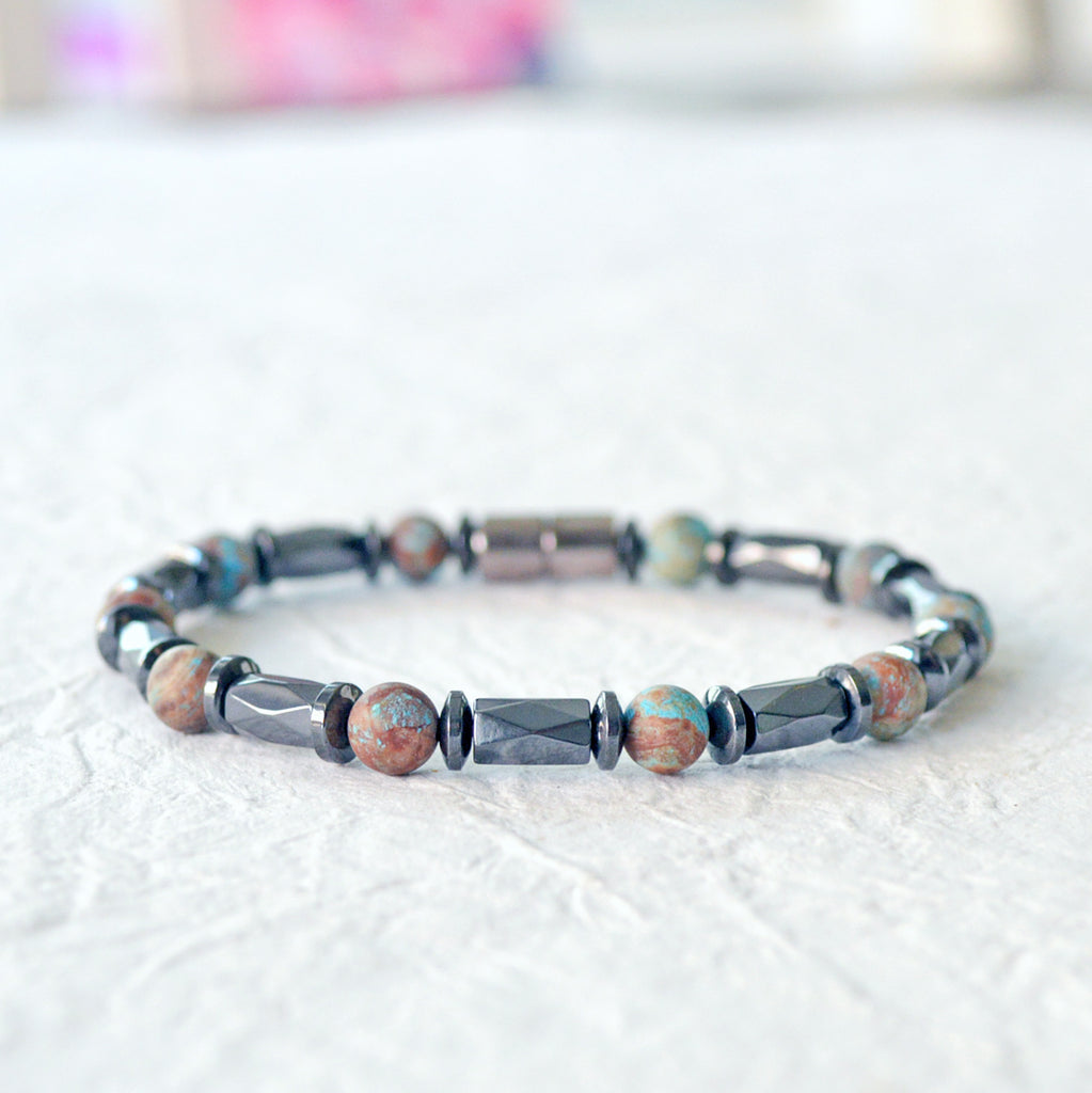 Magnetic bracelet handcrafted with black hematite magnetic beads and blue lace agate gemstone beads. Secured with a strong and easy-to-use magnetic clasp.