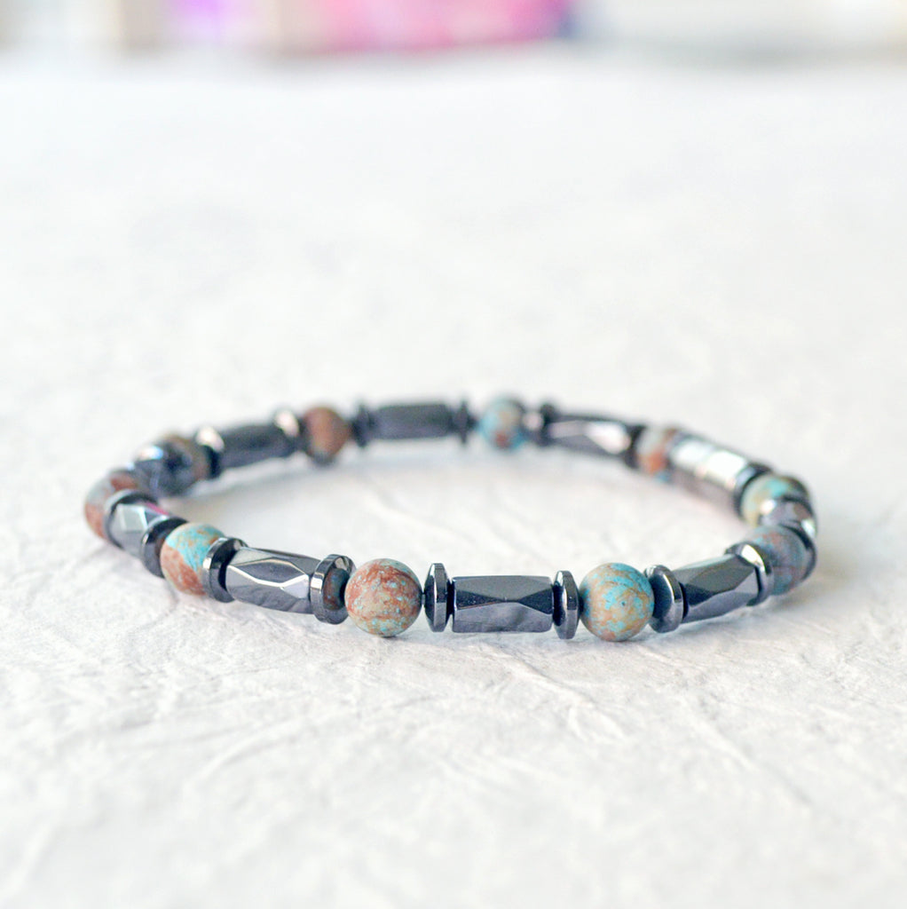 Magnetic bracelet handcrafted with black hematite magnetic beads and blue lace agate gemstone beads. Secured with a strong and easy-to-use magnetic clasp.