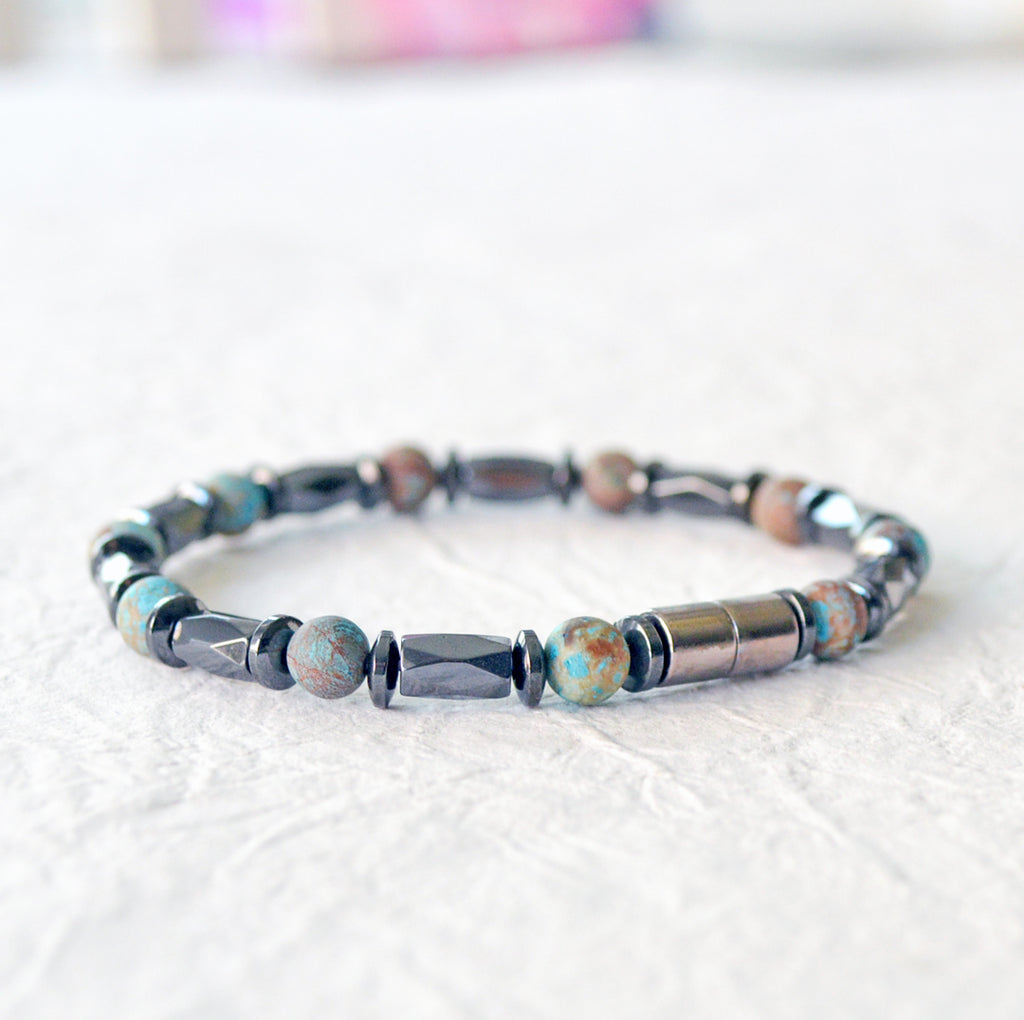 Magnetic bracelet handcrafted with black hematite magnetic beads and blue lace agate gemstone beads. Secured with a strong and easy-to-use magnetic clasp.