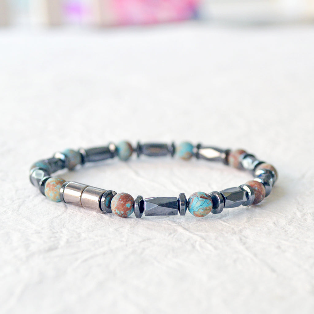 Magnetic bracelet handcrafted with black hematite magnetic beads and blue lace agate gemstone beads. Secured with a strong and easy-to-use magnetic clasp.