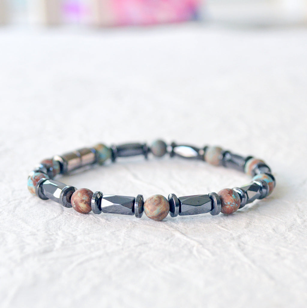 Magnetic bracelet handcrafted with black hematite magnetic beads and blue lace agate gemstone beads. Secured with a strong and easy-to-use magnetic clasp.