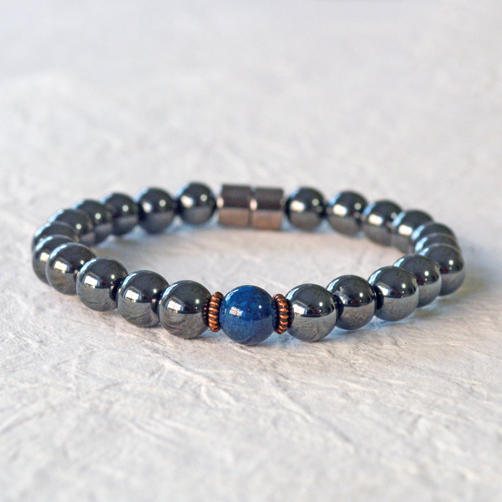 Magnetic Bracelet handcrafted with powerful black magnetic hematite beads and a center blue riverstone bead. Secured with a strong and easy-to-use magnetic clasp.