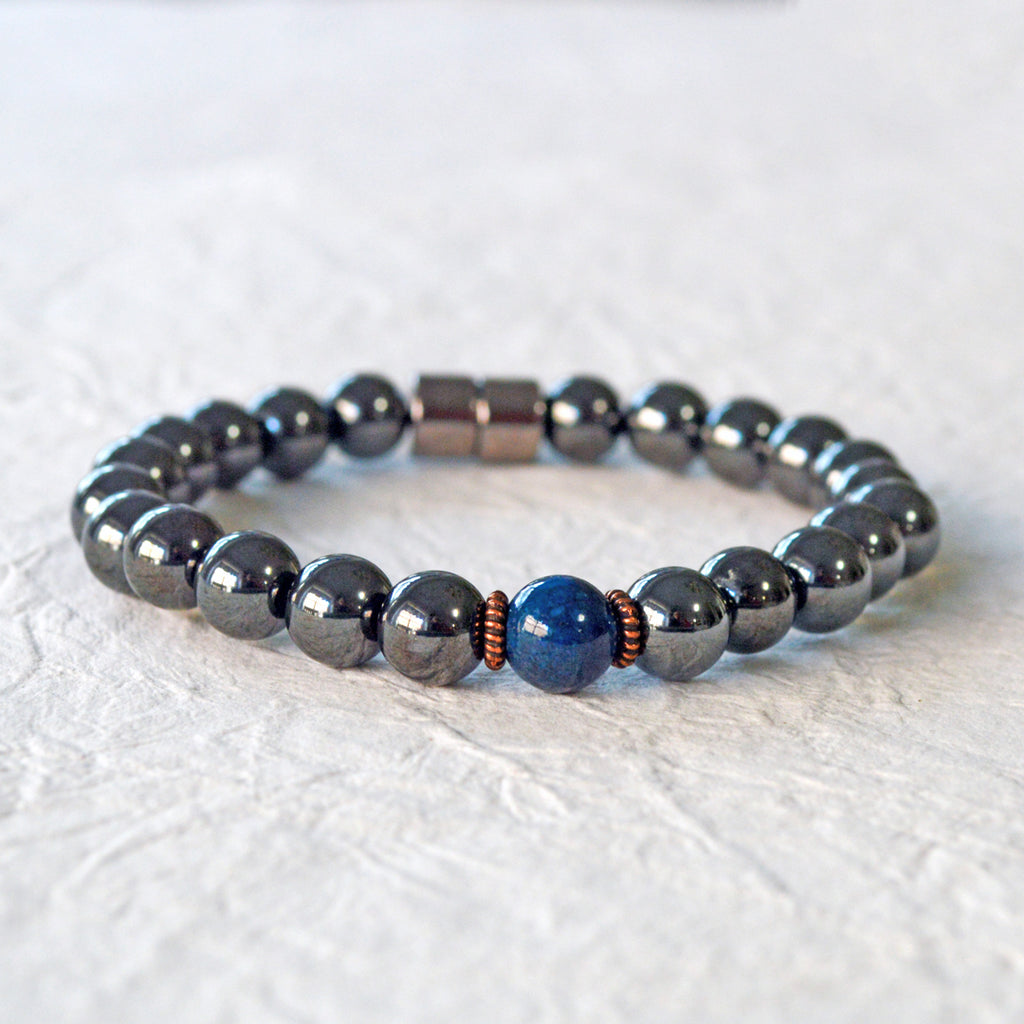 Magnetic Bracelet handcrafted with powerful black magnetic hematite beads and a center blue riverstone bead. Secured with a strong and easy-to-use magnetic clasp.