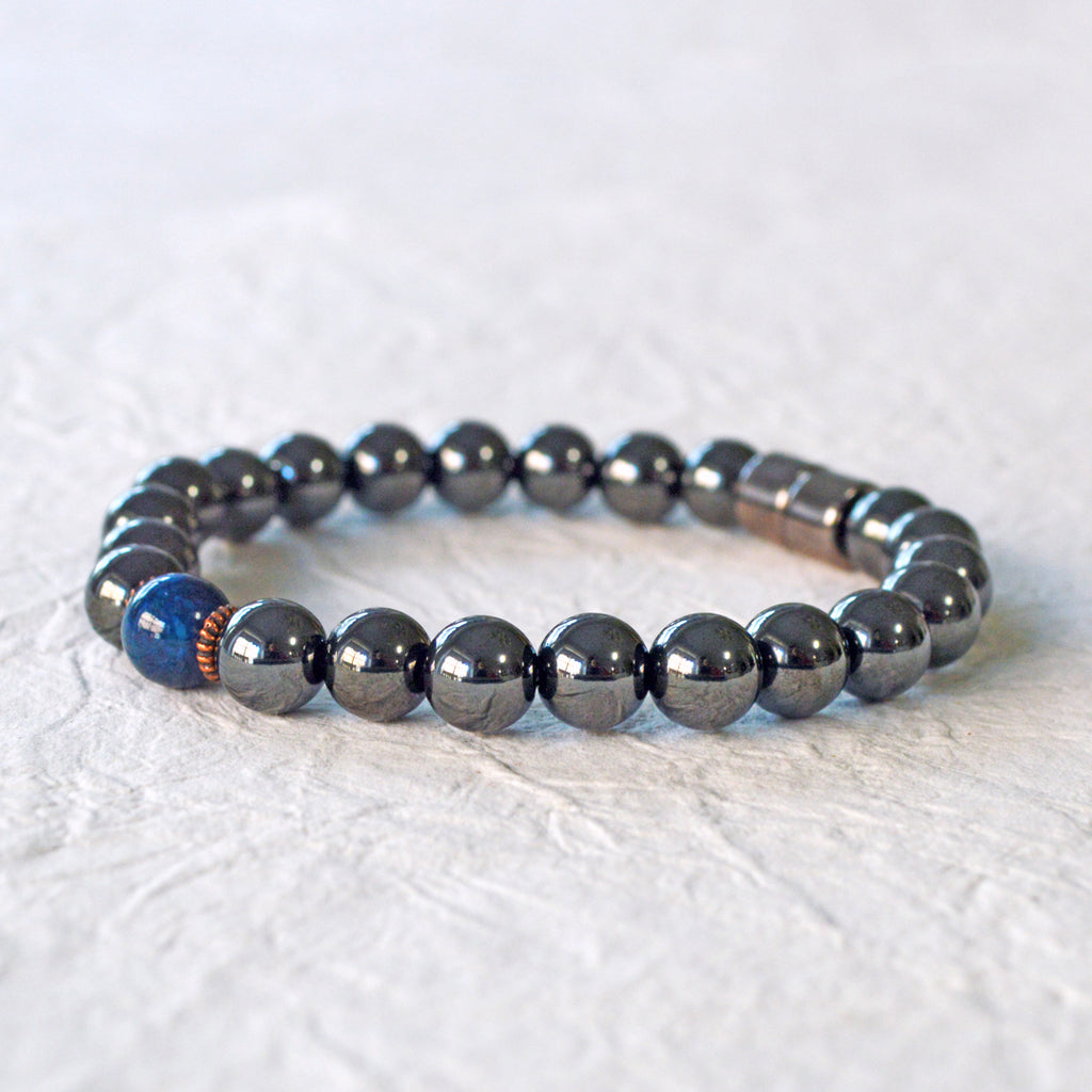 Magnetic Bracelet handcrafted with powerful black magnetic hematite beads and a center blue riverstone bead. Secured with a strong and easy-to-use magnetic clasp.