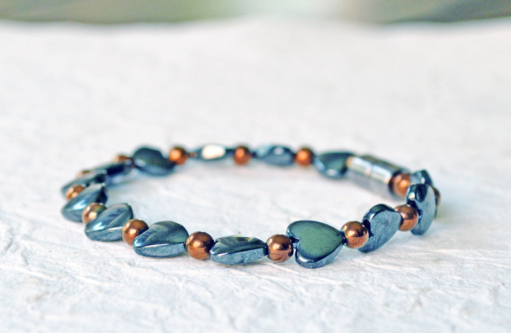 Magnetic heart bracelet for women handcrafted with alternating black hematite magnetic heart beads and copper metallic hematite magnetic beads. Bracelet secured with a strong and easy-to-use magnetic clasp.