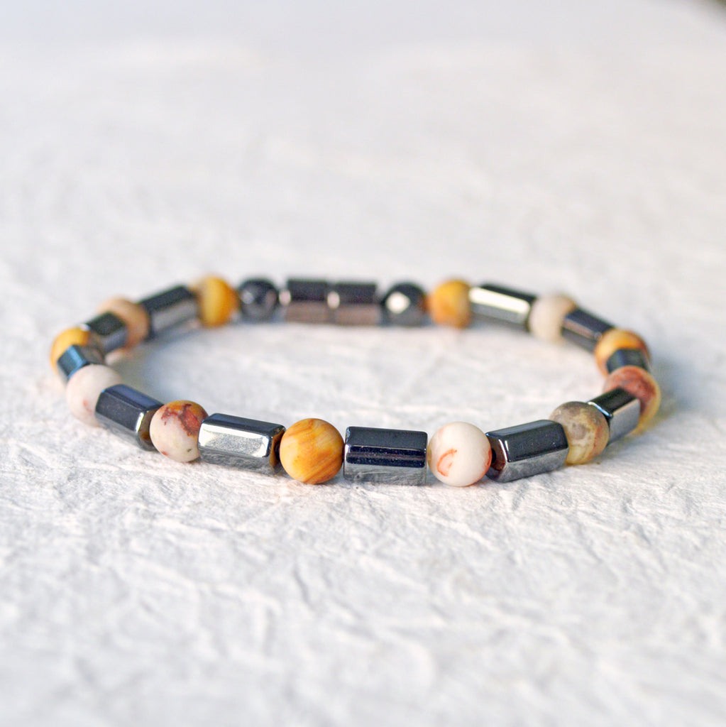 Magnetic hematite bracelet handcrafted with  black magnetic hematite bead and frosted agate gemstone bead. Secured with a strong magnetic clasp.