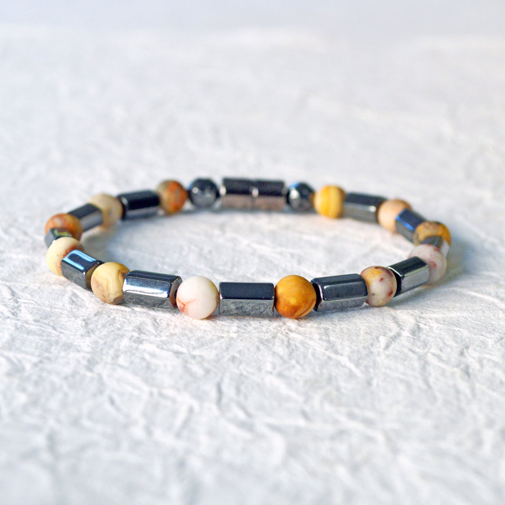Magnetic hematite bracelet handcrafted with  black magnetic hematite bead and frosted agate gemstone bead. Secured with a strong magnetic clasp.