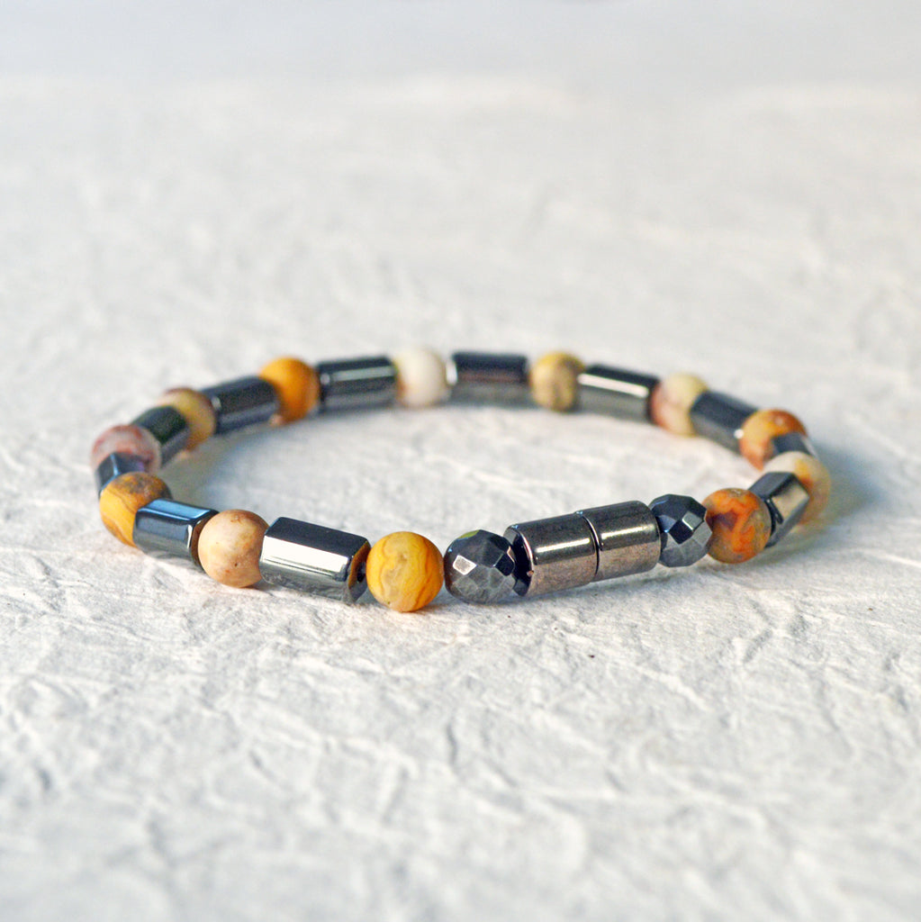 Magnetic hematite bracelet handcrafted with  black magnetic hematite bead and frosted agate gemstone bead. Secured with a strong magnetic clasp.