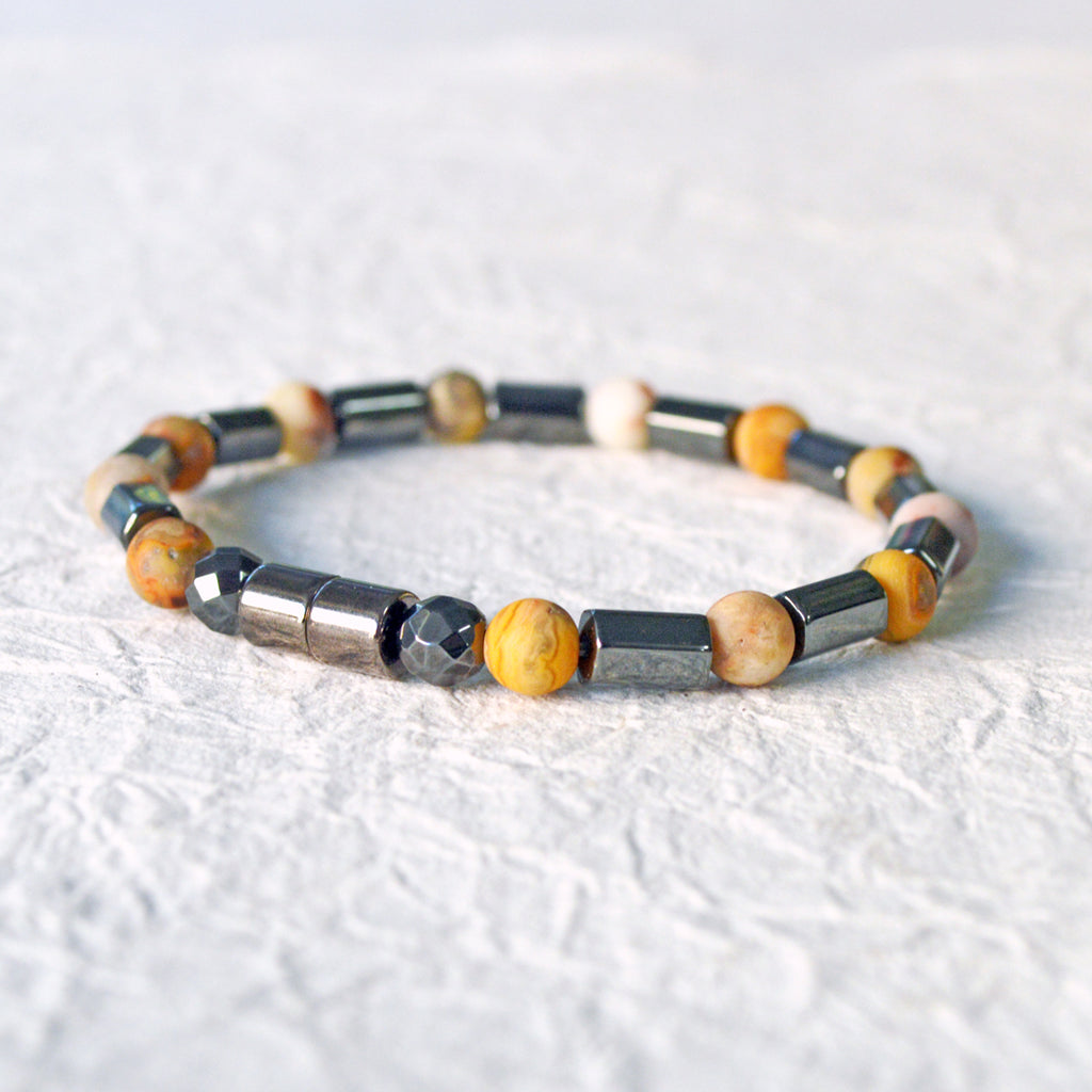 Magnetic hematite bracelet handcrafted with  black magnetic hematite bead and frosted agate gemstone bead. Secured with a strong magnetic clasp.
