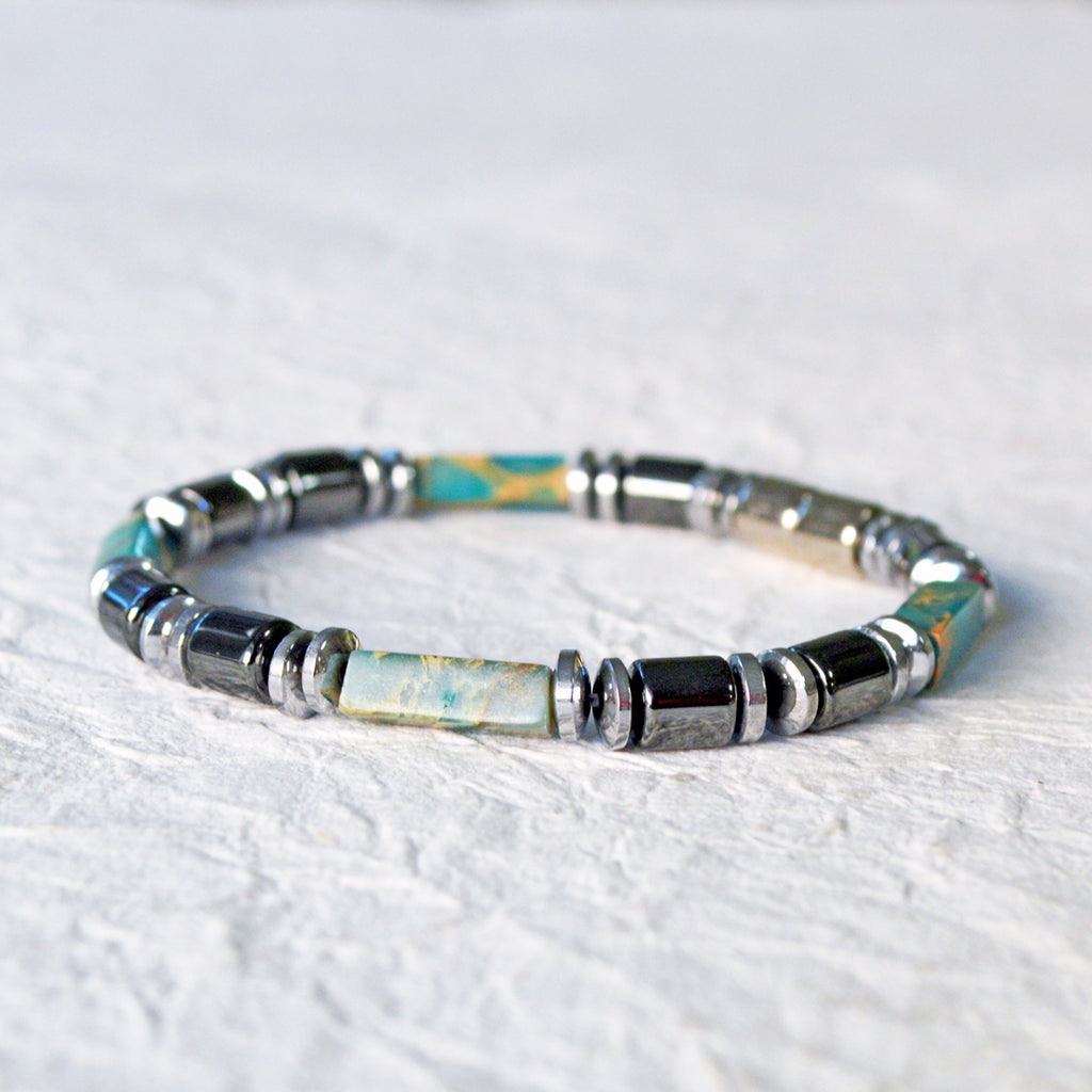Magnetic bracelet handcrafted with black and silver magnetic hematite beads with impression jasper gemstone beads. Secured with a strong and easy-to-use magnetic clasp.