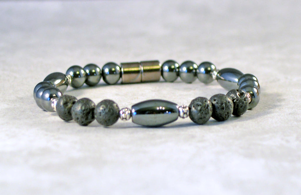 Handcrafted magnetic bracelet withh black high power hematite magnetic beads, lava rock beads, antique silver spacer beads. Secured with a strong magnetic clasp.