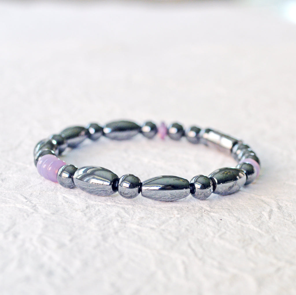 Magnetic bracelet handcrafted with black hematite magnetic beads and lavender czech glass beads. Bracelet secured with a strong and easy-to-use magnetic clasp.