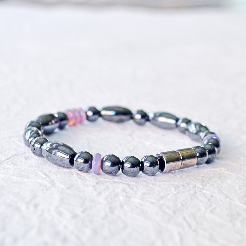 Magnetic bracelet handcrafted with black hematite magnetic beads and lavender czech glass beads. Bracelet secured with a strong and easy-to-use magnetic clasp.