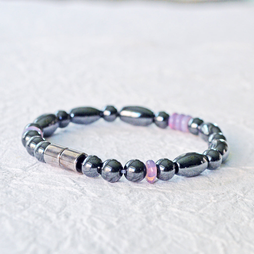 Magnetic bracelet handcrafted with black hematite magnetic beads and lavender czech glass beads. Bracelet secured with a strong and easy-to-use magnetic clasp.