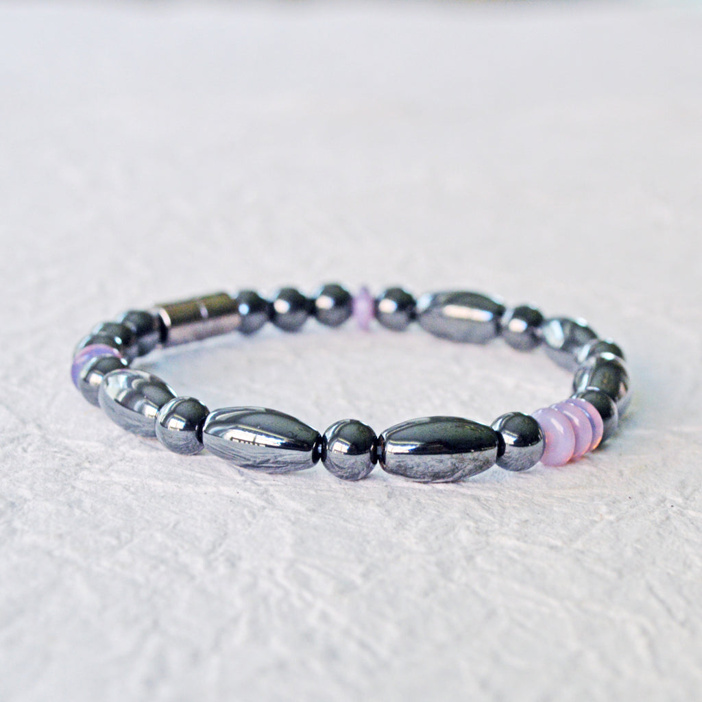 Magnetic bracelet handcrafted with black hematite magnetic beads and lavender czech glass beads. Bracelet secured with a strong and easy-to-use magnetic clasp.
