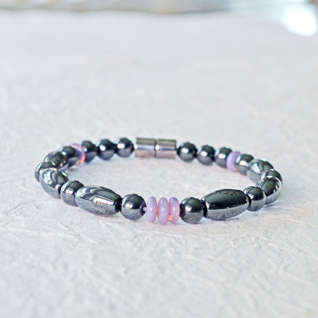 Magnetic bracelet handcrafted with black hematite magnetic beads and lavender czech glass beads. Bracelet secured with a strong and easy-to-use magnetic clasp.