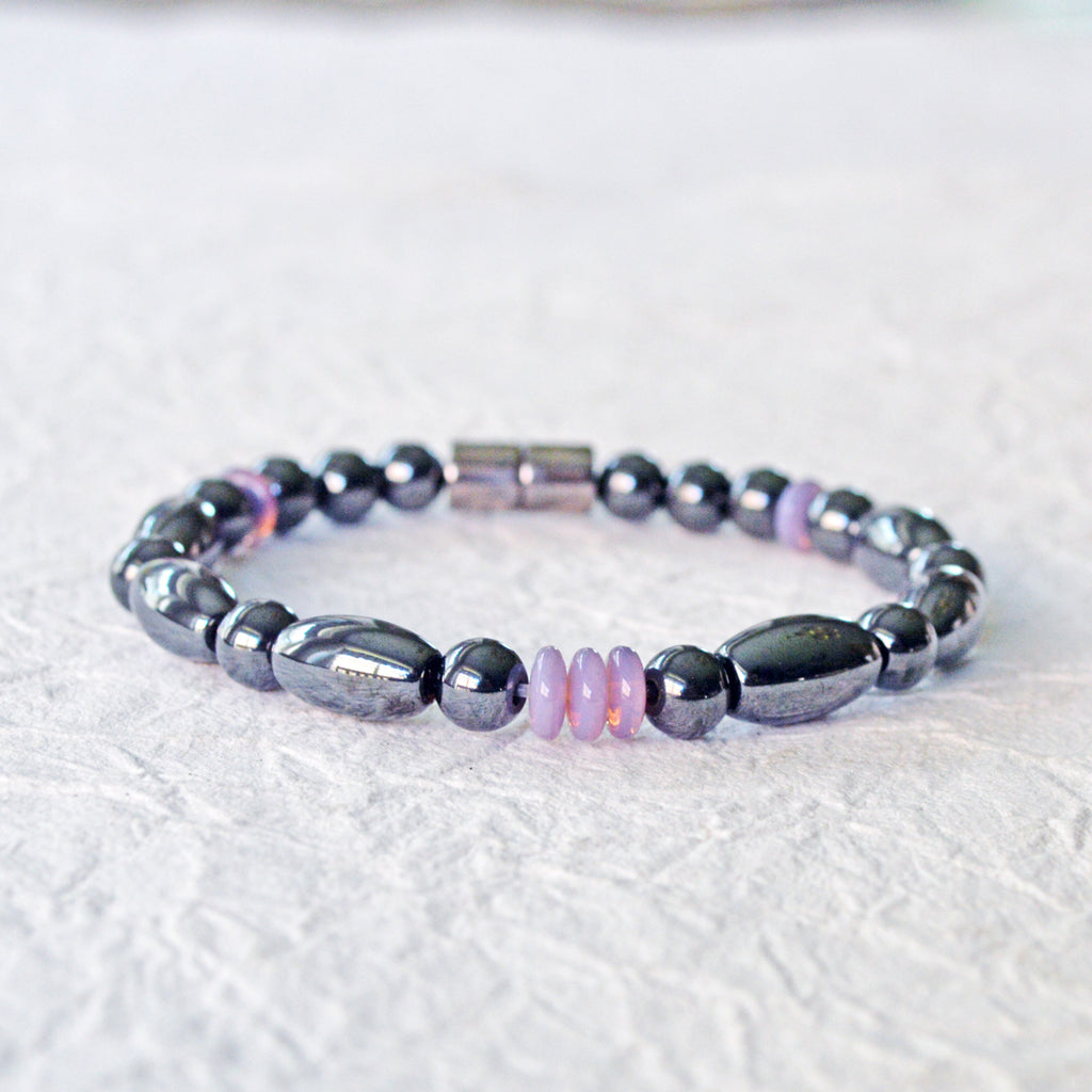 Magnetic bracelet handcrafted with black hematite magnetic beads and lavender czech glass beads. Bracelet secured with a strong and easy-to-use magnetic clasp.