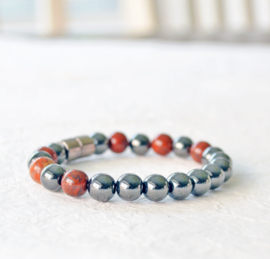 Magnetic therapy bracelet handcrafted with black hematite magnetic beads and poppy jasper gemstone beads. Bracelet secured with a strong and easy-to-use magnetic clasp.