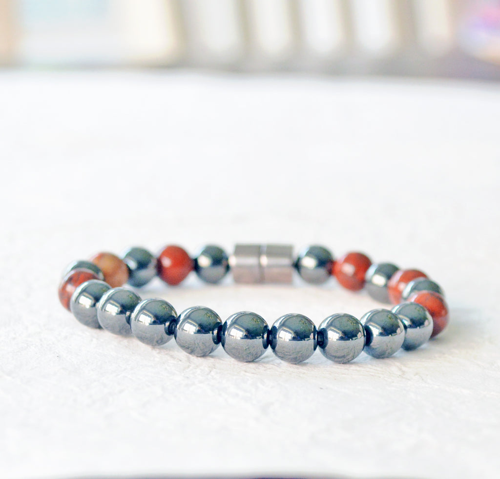 Magnetic therapy bracelet handcrafted with black hematite magnetic beads and poppy jasper gemstone beads. Bracelet secured with a strong and easy-to-use magnetic clasp.