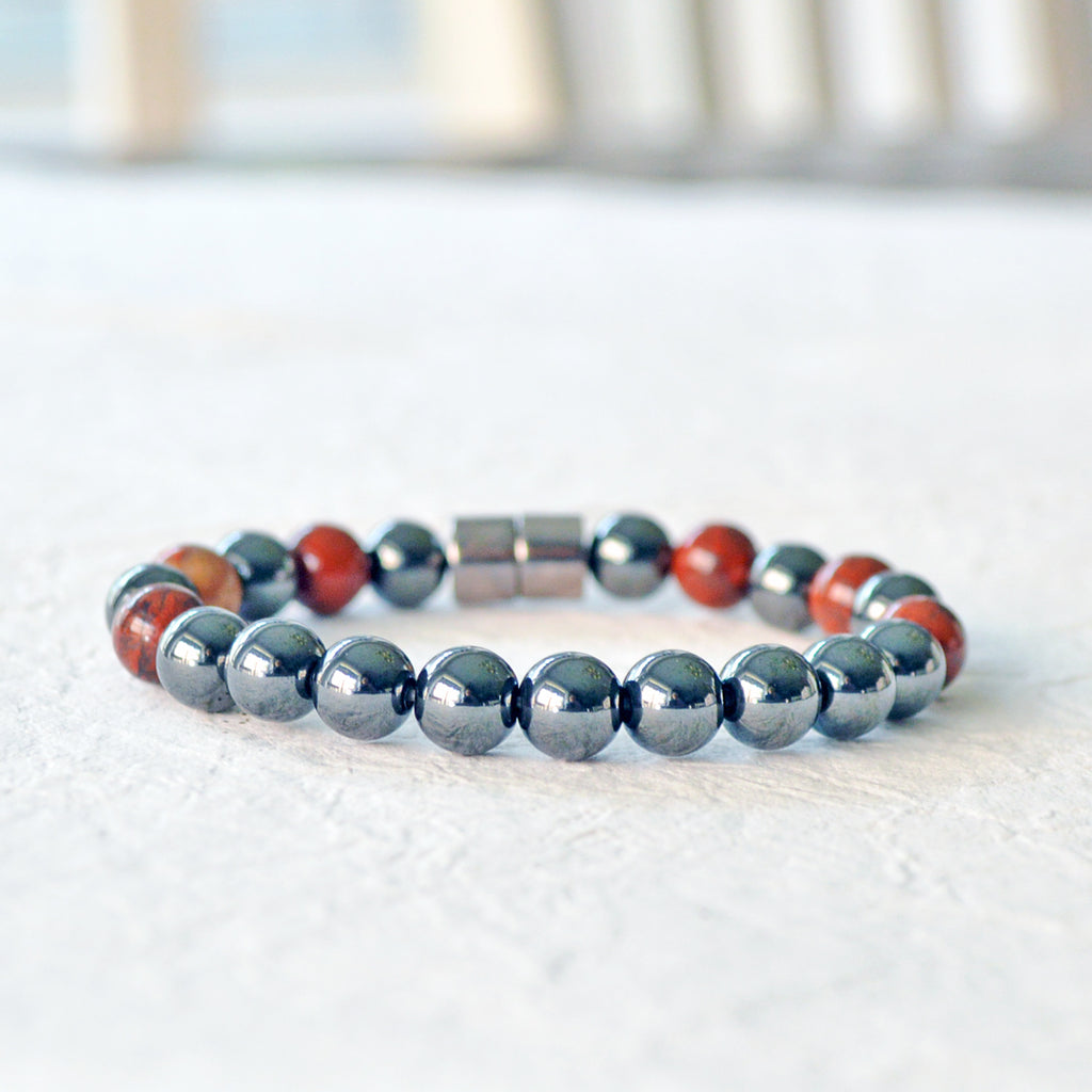 Magnetic therapy bracelet handcrafted with black hematite magnetic beads and poppy jasper gemstone beads. Bracelet secured with a strong and easy-to-use magnetic clasp.