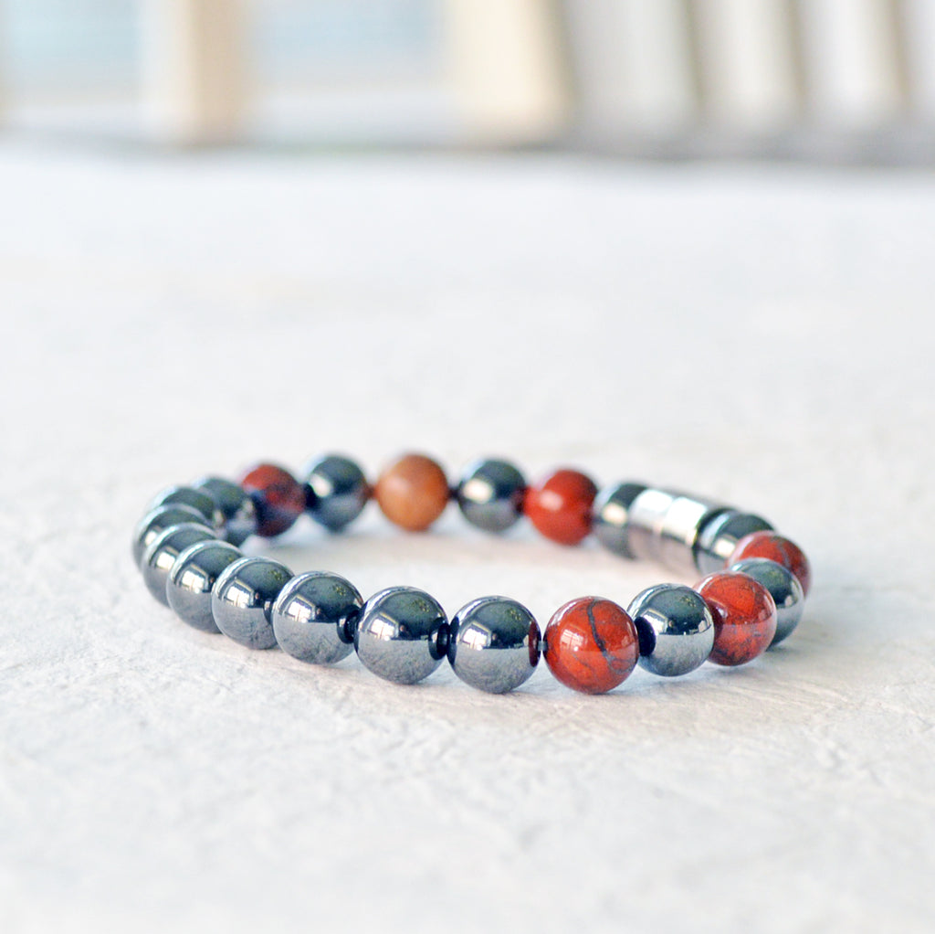 Magnetic therapy bracelet handcrafted with black hematite magnetic beads and poppy jasper gemstone beads. Bracelet secured with a strong and easy-to-use magnetic clasp.