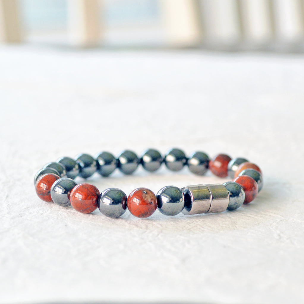 Magnetic therapy bracelet handcrafted with black hematite magnetic beads and poppy jasper gemstone beads. Bracelet secured with a strong and easy-to-use magnetic clasp.