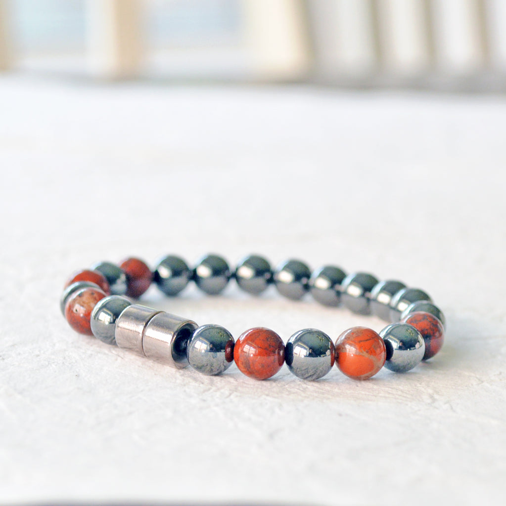 Magnetic therapy bracelet handcrafted with black hematite magnetic beads and poppy jasper gemstone beads. Bracelet secured with a strong and easy-to-use magnetic clasp.