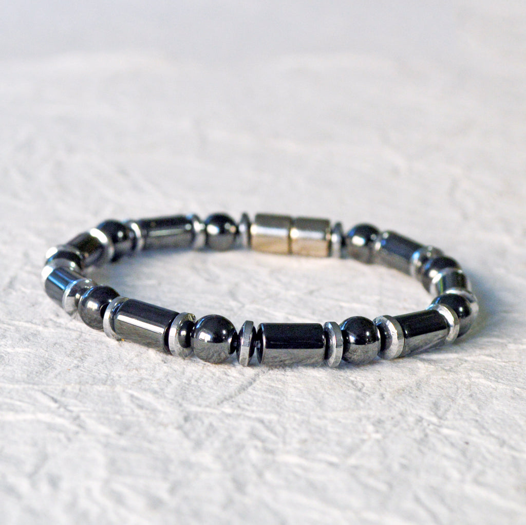 Black and silver magnetic bracelet for men handcrafted with powerful magnetic hematite beads. Bracelet secured with a strong and easy-to-use magnetic clasp.