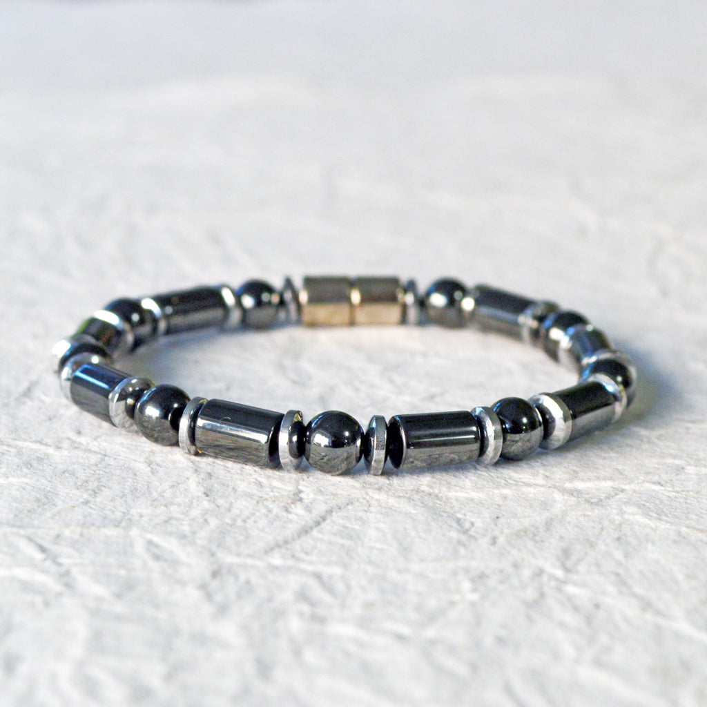 Black and silver magnetic bracelet for men handcrafted with powerful magnetic hematite beads. Bracelet secured with a strong and easy-to-use magnetic clasp.
