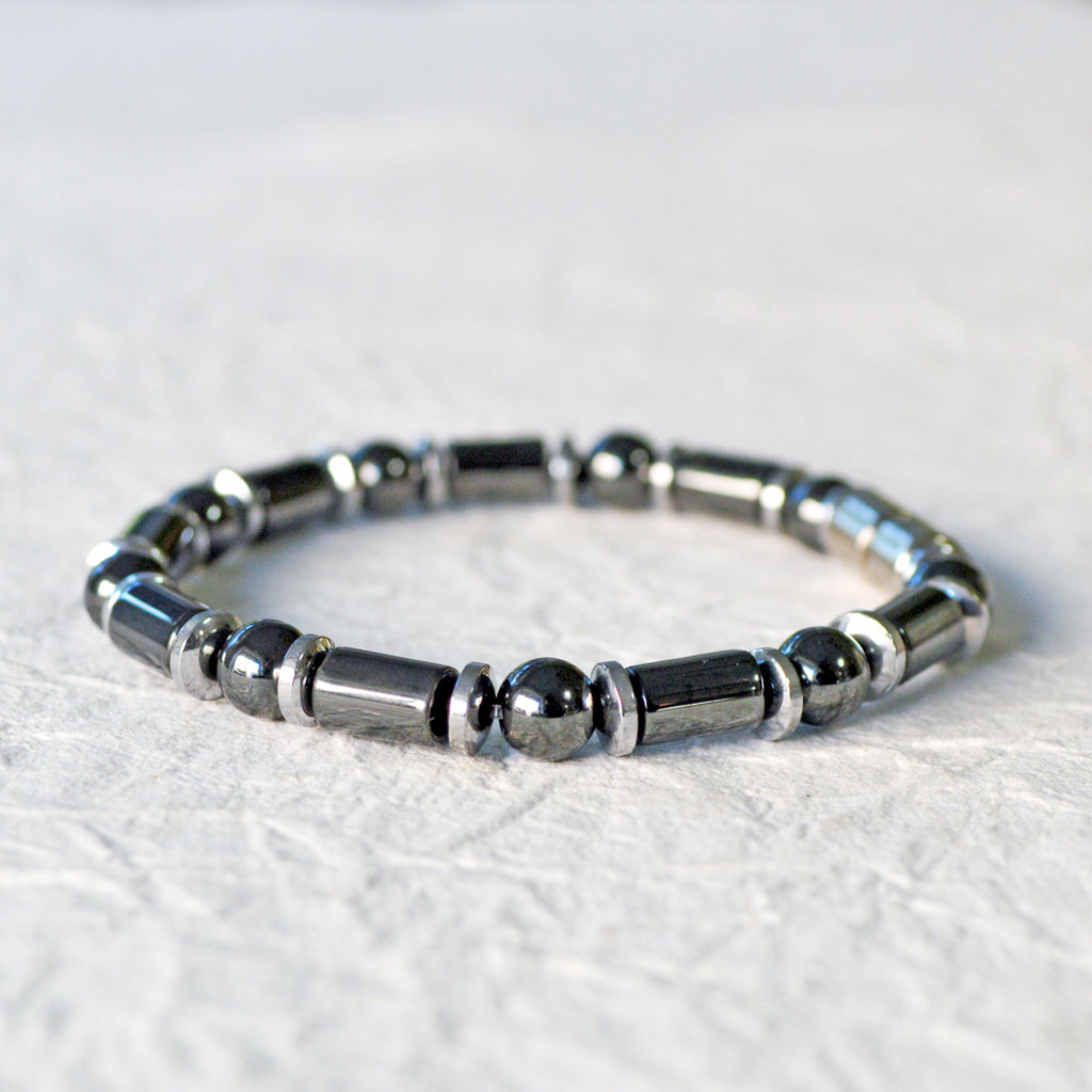 Black and silver magnetic bracelet for men handcrafted with powerful magnetic hematite beads. Bracelet secured with a strong and easy-to-use magnetic clasp.