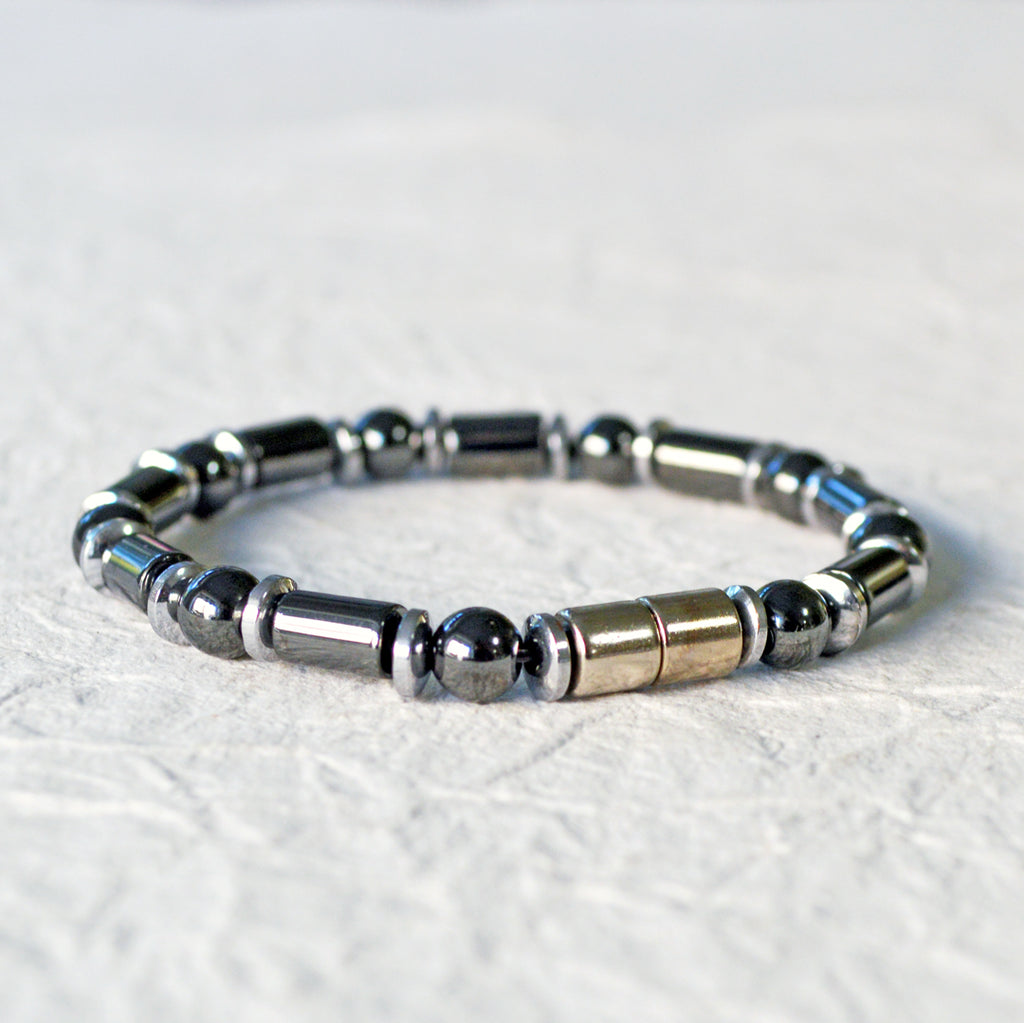 Black and silver magnetic bracelet for men handcrafted with powerful magnetic hematite beads. Bracelet secured with a strong and easy-to-use magnetic clasp.
