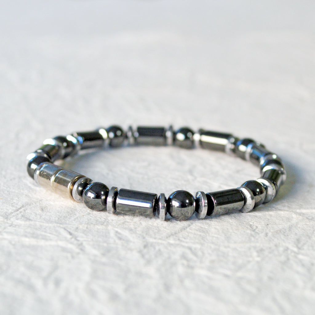 Black and silver magnetic bracelet for men handcrafted with powerful magnetic hematite beads. Bracelet secured with a strong and easy-to-use magnetic clasp.