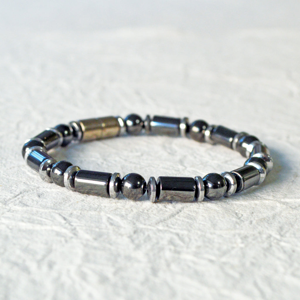 Black and silver magnetic bracelet for men handcrafted with powerful magnetic hematite beads. Bracelet secured with a strong and easy-to-use magnetic clasp.