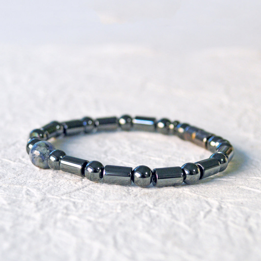 Magnetic therapy bracelet handcrafted with black hematite magnetic beads with a single sodalite gemstone bead in the center. Secured with a strong and easy-to-use magnetic clasp.