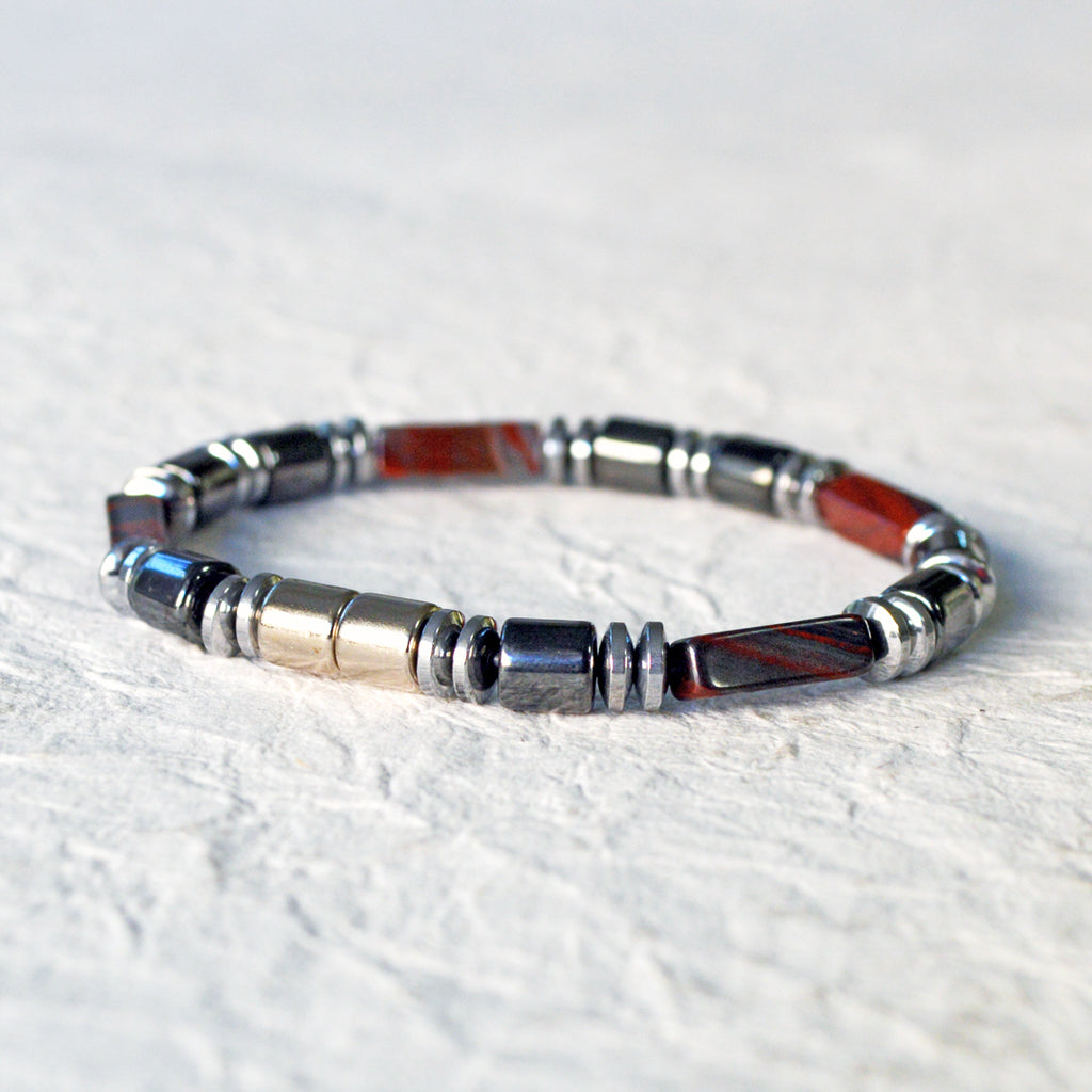 Magnetic bracelet handcrafted with black and silver hematite magnetic beads and tiger iron gemstone beads. Bracelet is secured with a strong, easy-to-use magnetic clasp. Can be worn as a bracelet or ankle bracelet.