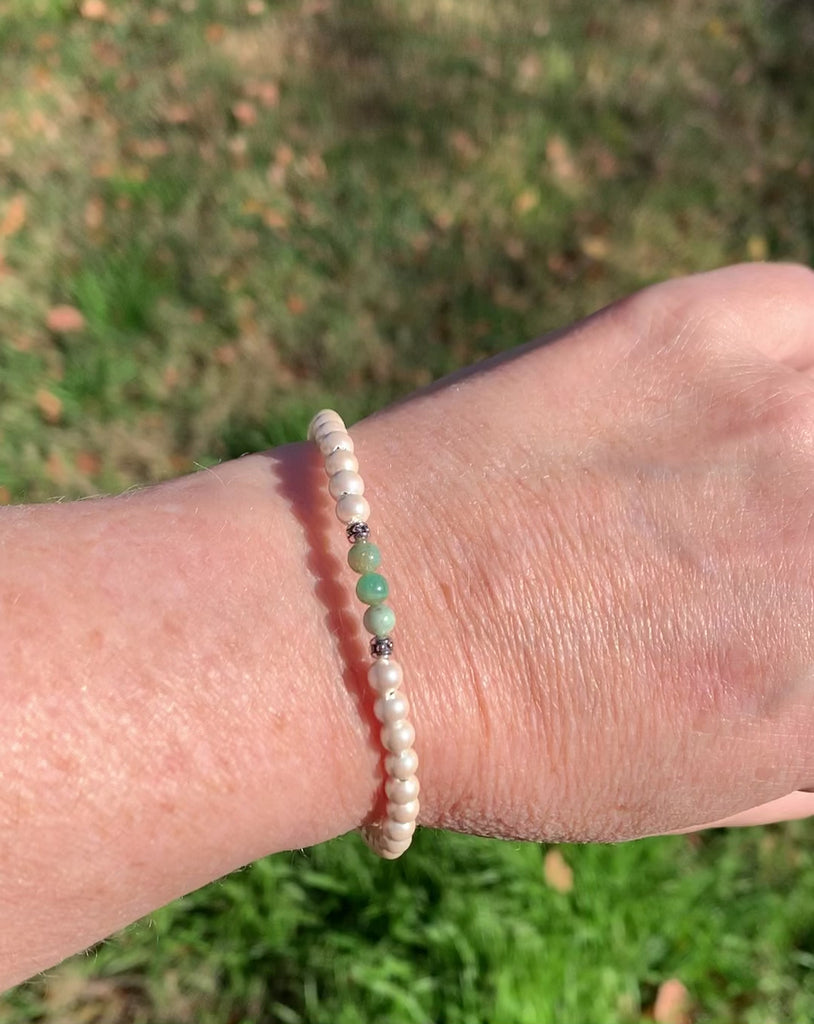 Magnetic bracelet handcrafted with cream pearl hematite magnetic beads with african jade gemstone beads in the center. Secured with a strong and easy-to-use magnetic clasp. Wear as a magnetic  bracelet or magnetic ankle bracelet.