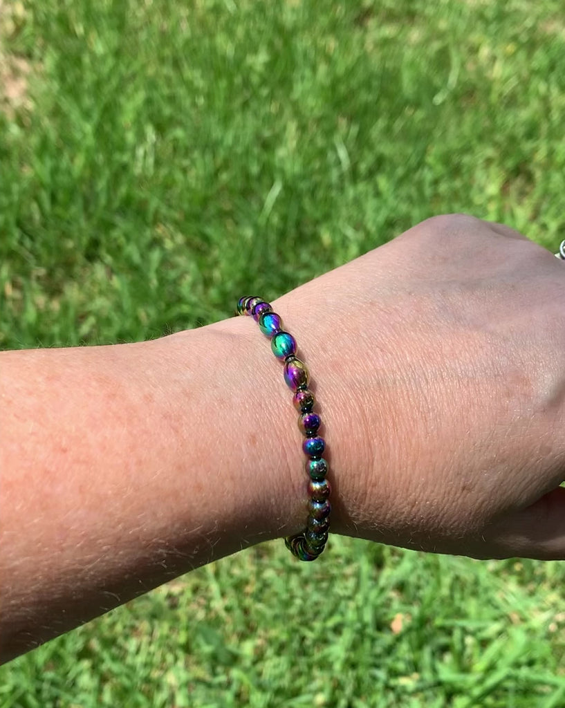 Magnetic wellness bracelet handcrafted with iridescent rainbow hematite magnetic beads. Bracelet is secured with a strong and easy-to-use magnetic clasp.
