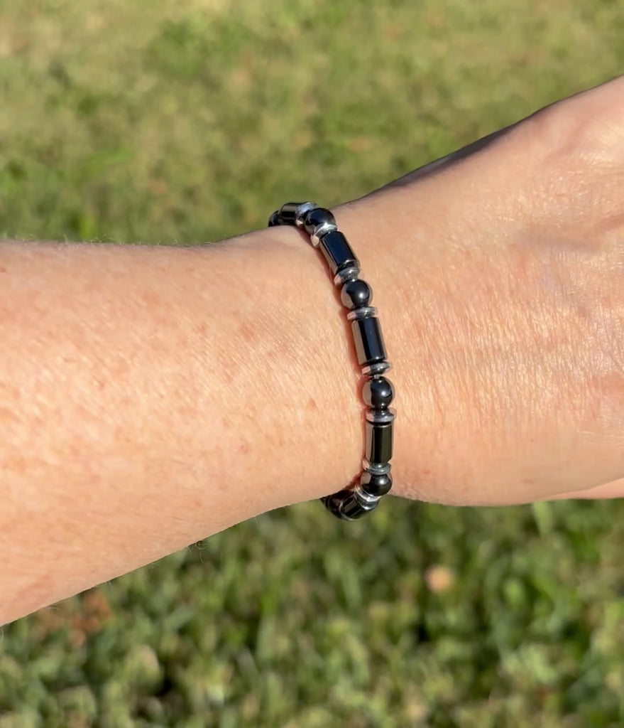 Black and silver magnetic bracelet for men handcrafted with powerful magnetic hematite beads. Bracelet secured with a strong and easy-to-use magnetic clasp.