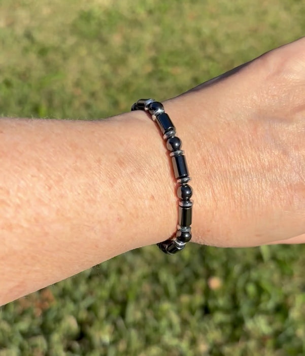 Black and silver magnetic bracelet for men handcrafted with powerful magnetic hematite beads. Bracelet secured with a strong and easy-to-use magnetic clasp.