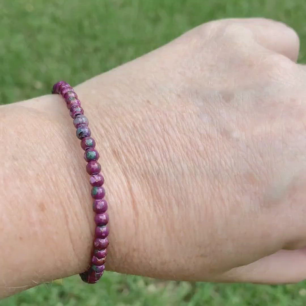 Magnetic hematite bracelet handcrafted with burgundy picasso magnetic hematite beads. Secured with a strong and easy-to-use magnetic clasp.