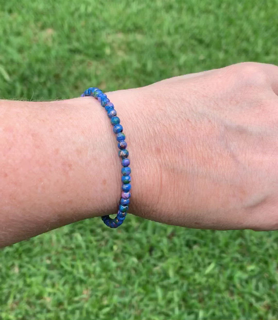 Magnetic bracelet is handcrafted with blue picasso hematite magnetic beads. It is secured with a strong and easy-to-use magnetic clasp.